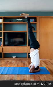 Portrait of a man doing yoga exercise while staying at home. New normal lifestyle concept. Sport concept.