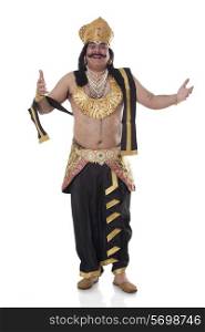 Portrait of a man dressed as Raavan gesturing