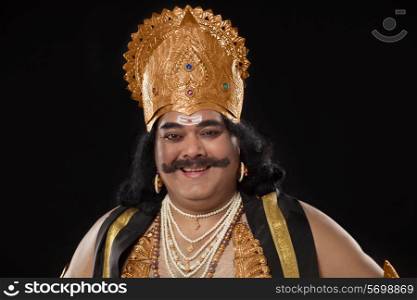 Portrait of a man dressed as Raavan smiling