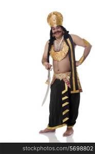 Portrait of a man dressed as Raavan with a sword