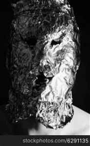 Portrait of a man dressed in scary masks foil