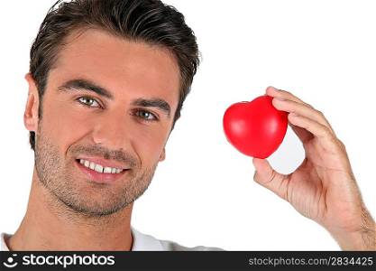 Portrait of a man holding a heart