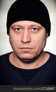 portrait of a man in a black knitted hat
