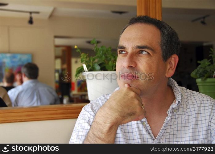 Portrait of a man in a cafe
