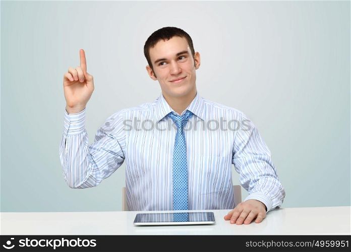 Portrait of a man in business wear making presentation