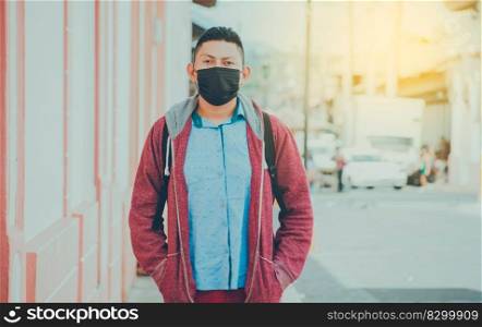Portrait of a man in the street with a mask, portrait of a young Latino man with a mask in the street