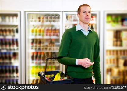 Portrait of a man looking at the camera in a grocery store