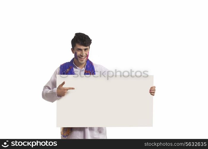 Portrait of a man pointing to a white board