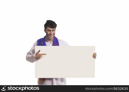 Portrait of a man pointing to a white board