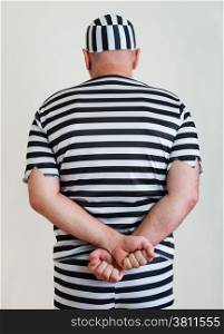 portrait of a man prisoner in prison garb
