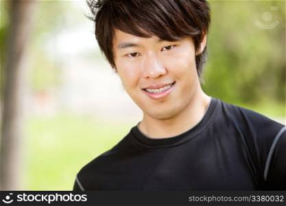 Portrait of a man smiling against blur background