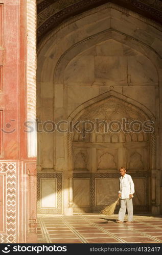 Portrait of a man standing in the Jawab Mosque, Agra, Uttar Pradesh, India