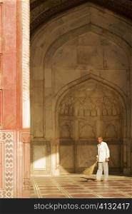 Portrait of a man standing in the Jawab Mosque, Agra, Uttar Pradesh, India