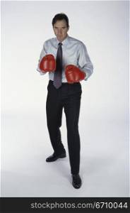 Portrait of a man wearing boxing gloves