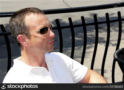 Portrait of a man wearing sunglasses in outdoor cafe