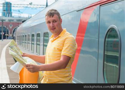 portrait of a man with a map at the station