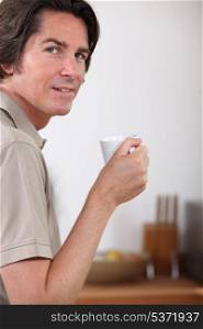 portrait of a man with coffee cup