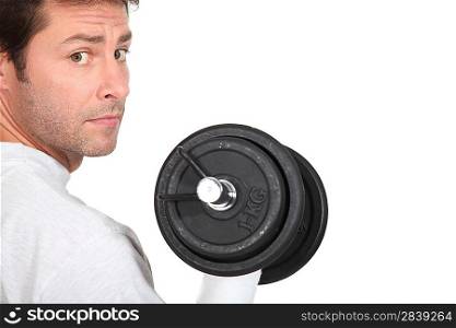 portrait of a man with dumbbell