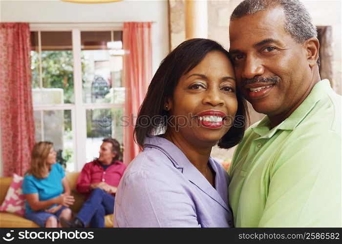 Portrait of a mature couple embracing each other and smiling