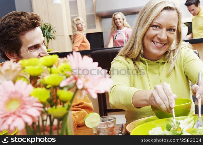 Portrait of a mature couple sitting at the dining table