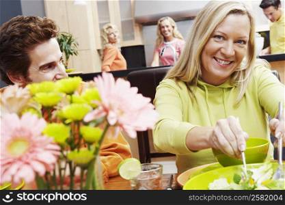 Portrait of a mature couple sitting at the dining table