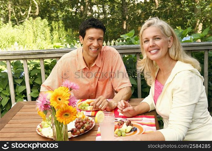 Portrait of a mature couple sitting at the table