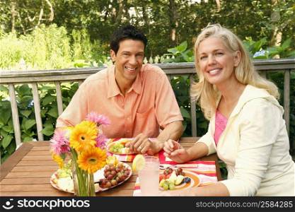 Portrait of a mature couple sitting at the table