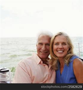 Portrait of a mature couple smiling together in a boat