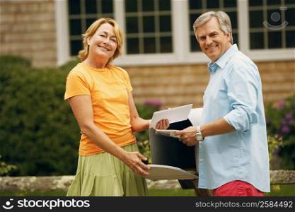 Portrait of a mature couple standing near a mailbox