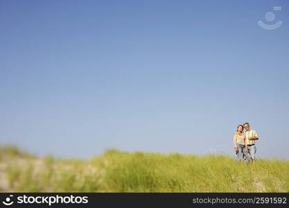 Portrait of a mature couple standing on the beach