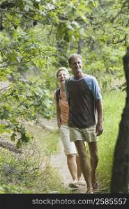 Portrait of a mature couple walking in a forest