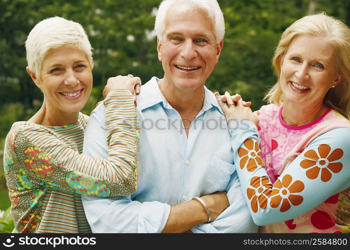 Portrait of a mature couple with a senior woman smiling