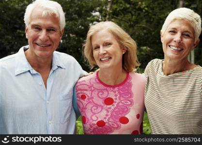 Portrait of a mature couple with a senior woman smiling