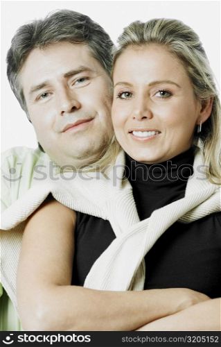 Portrait of a mature man and a mid adult woman smiling