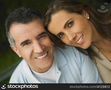 Portrait of a mature man and a mid adult woman smiling