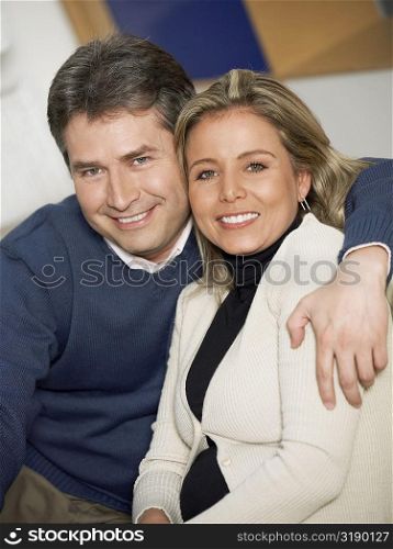 Portrait of a mature man and a mid adult woman smiling together