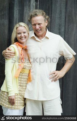 Portrait of a mature man and a mid adult woman standing together and smiling
