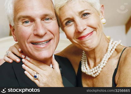 Portrait of a mature man and a senior woman smiling