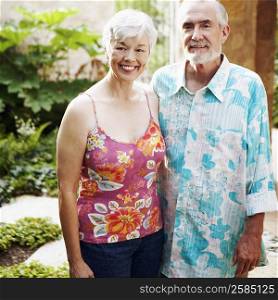Portrait of a mature man and a senior woman standing together and smiling