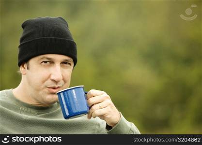 Portrait of a mature man drinking from a mug