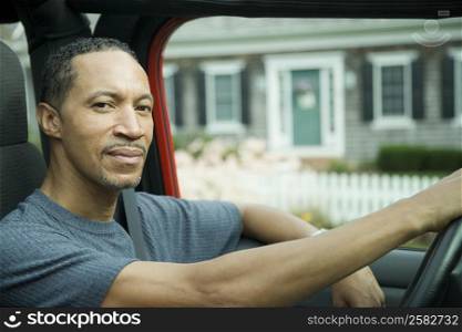 Portrait of a mature man driving a car