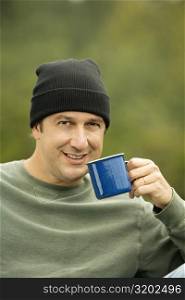 Portrait of a mature man holding a mug