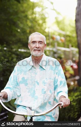 Portrait of a mature man riding a bicycle