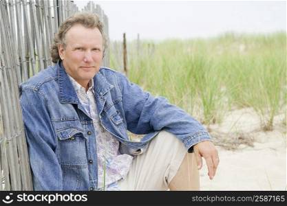 Portrait of a mature man sitting on the beach