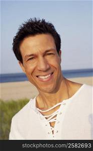 Portrait of a mature man smiling on the beach