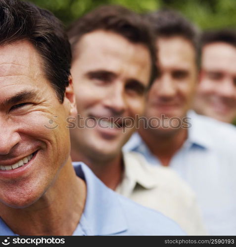 Portrait of a mature man smiling with his friends in the background