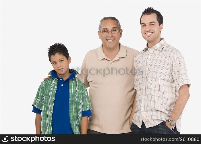 Portrait of a mature man smiling with his son and grandson