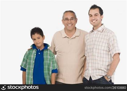 Portrait of a mature man smiling with his son and grandson