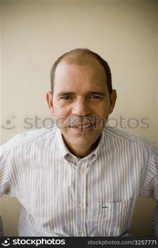 Portrait of a mature man smirking