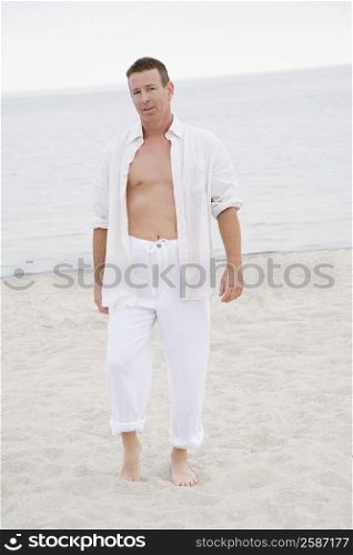Portrait of a mature man standing on the beach